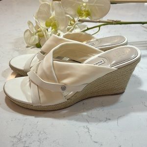 Dana Buchman woman’s white high heeled slip on sandals, size 8.5.